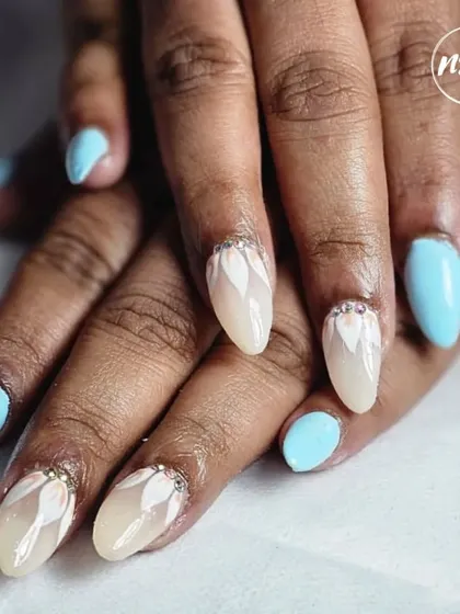 A beautiful combination of baby blue and a neutral base with a white petal design. The small rhinestone accents add just the right amount of sparkle.