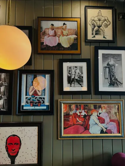 The art on my walls tells stories of my travels and my mischievous personality. It's a gallery of my life.
