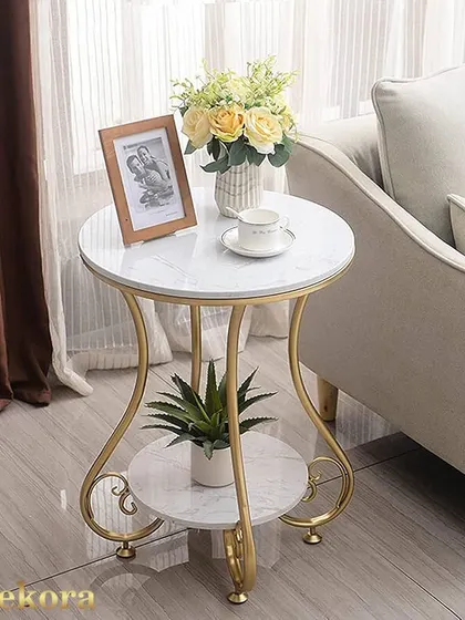 A modern style coffee table combining a gold-finish metal frame with white marble-finish tops. The curved legs and two-tier design offer a blend of elegance and practicality for any home.