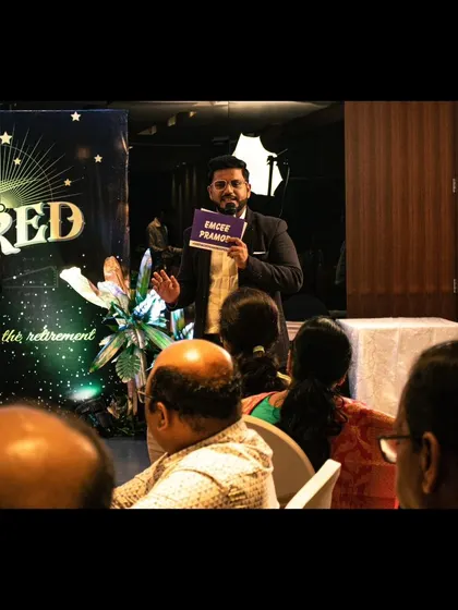 Interacting with the audience at the retirement party, making everyone feel involved.