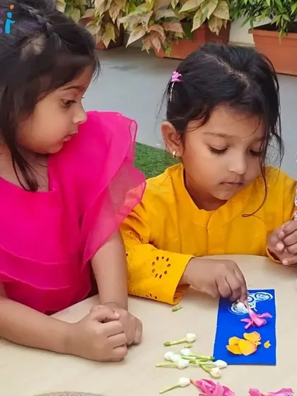 A girl shows intense focus as she arranges flowers on her bookmark. This Vasant Panchami craft is a beautiful expression of the season's vitality.