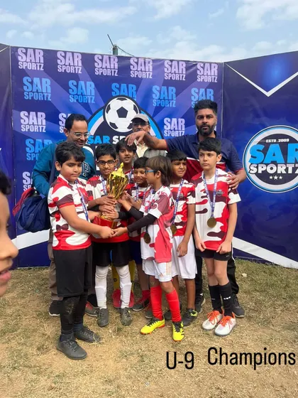 The U-9 Champions proudly holding their trophy. A great moment for these young stars.