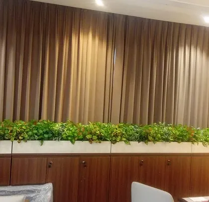 Another view of the long office planter, showing how it adds a consistent line of green across the top of the storage units.