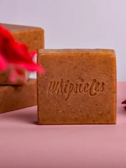 Our Floral Bliss soap, surrounded by fresh flowers. It's a gentle formula that soothes and hydrates, leaving a soft, radiant glow.