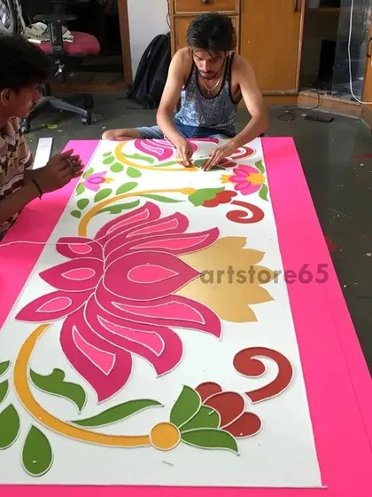 Our team collaborating on a single piece, ensuring every detail of the lotus-themed Lippan art is perfect. This teamwork is essential for large and complex projects.