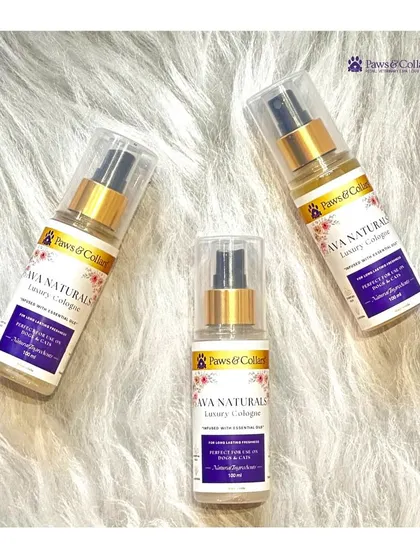 Three bottles of our Ava Naturals Luxury Cologne are artfully arranged on a soft, white fur background, highlighting the product's clean and gentle properties.