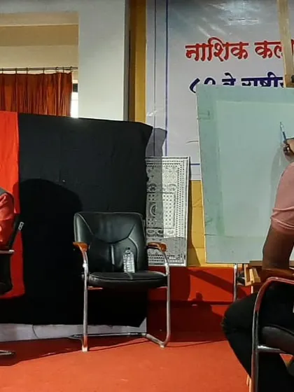 Beginning the watercolour portrait at Nashik Kala Niketan. The first washes of colour establish the basic tones and structure of the face.