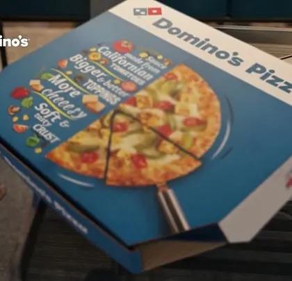 A product shot of the Domino's pizza box. Even in these shots, the context of a casual, fun gathering is important to the overall campaign story.