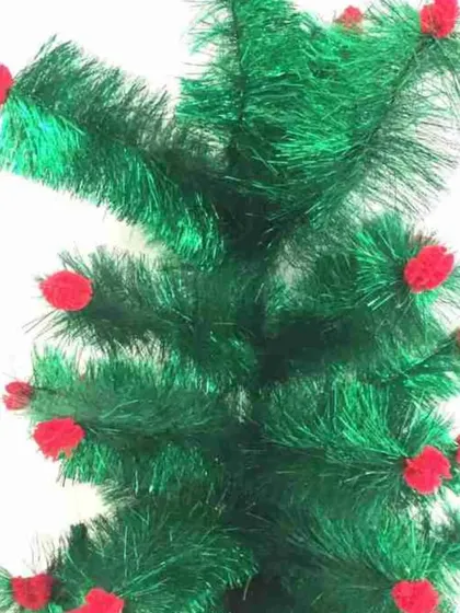 A close-up of a green tinsel Christmas tree decoration. This can be used as a small tabletop tree or as part of a larger festive display.