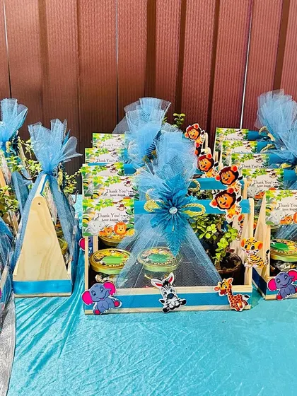 Custom-themed return gifts for a jungle party. We can help you source and package party favors that match your theme perfectly.