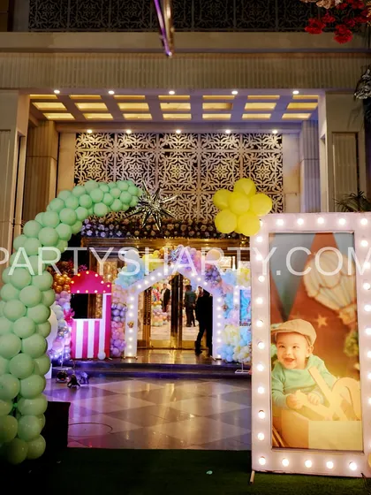 The entrance to a carnival party at night, showing how lighting plays a key role in creating a magical and inviting atmosphere.