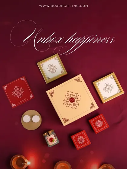 Unbox happiness with this beautifully arranged hamper. The elegant box opens to reveal small gift boxes, diyas, and gourmet treats, creating a memorable Diwali experience.