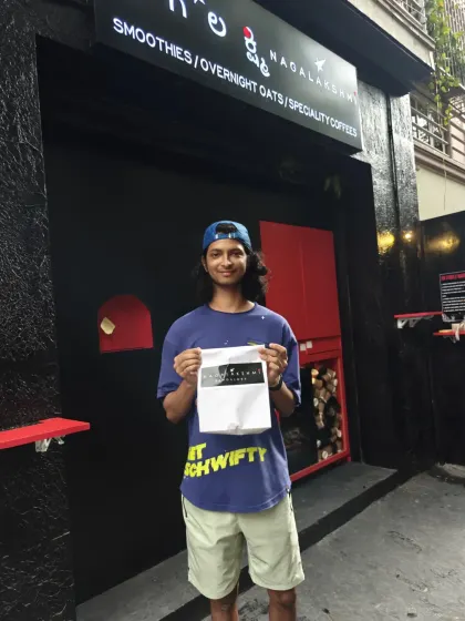 A happy customer with his takeaway order. Seeing people enjoy the food and the experience is why I started this. It's all about serving the Bohofit community.