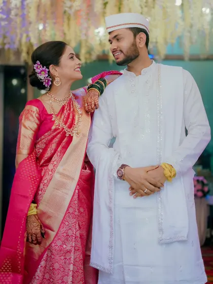 A sweet, candid moment between a couple during their engagement. The bride's smile as she looks at her partner says it all.
