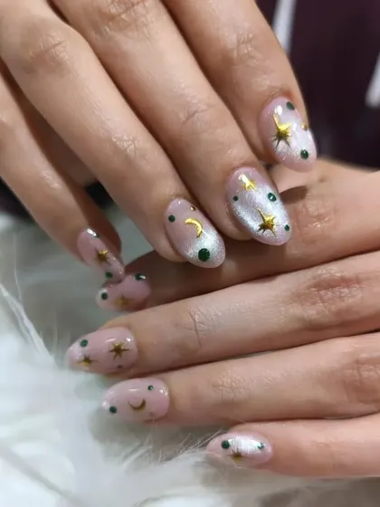 Another angle of our celestial nail art, showing the shimmer of the base coat and the detail of the gold stars.
