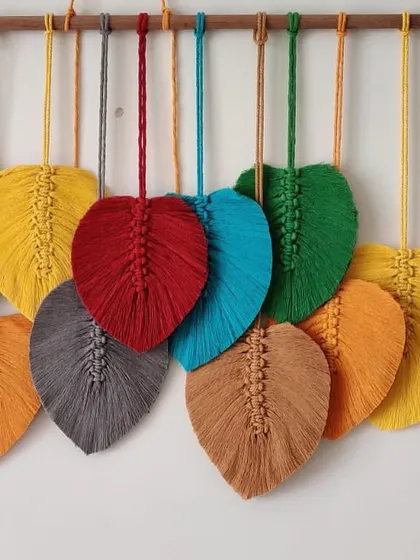 A closer look at the overlapping leaves in this custom wall hanging.