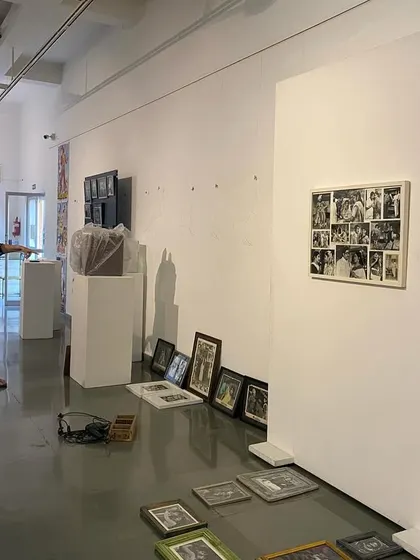 The artist and curator discussing the layout in the early stages of installation.