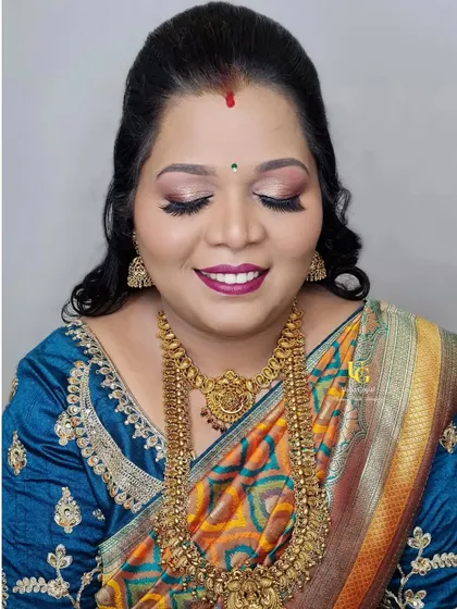 A gorgeous makeover for a son's birthday party. This look balances a defined eye with a bold lip, a versatile technique you can learn for any party.