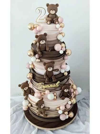 A full view of the multi-tiered teddy bear cake, showing how fondant can be used to create amazing texture and structure.