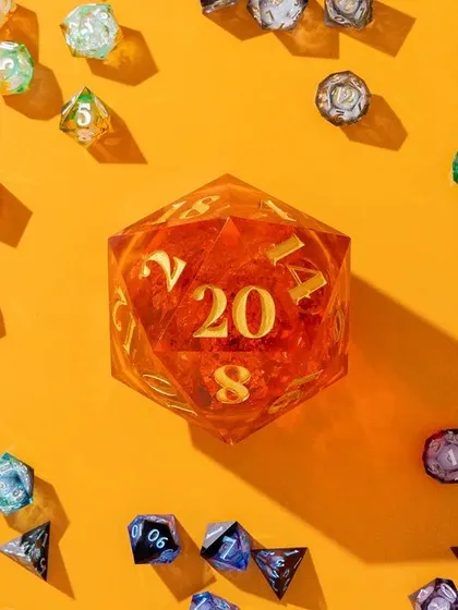 A vibrant and playful flatlay of the entire Wild Earth Dice collection. The dice are scattered around a giant D20 die on a bright orange background, creating a colorful and energetic composition.