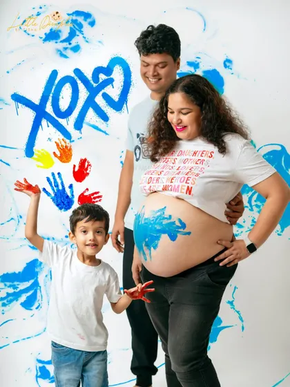 The aftermath of a fun and messy paint session. These are the moments of pure joy and family connection that I love to capture.
