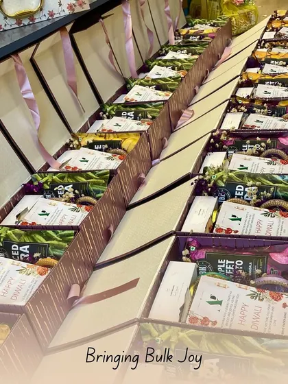 Bringing bulk joy, one hamper at a time. This image shows rows of festive Diwali hampers being prepared, showcasing my capacity to handle large corporate and personal orders while maintaining quality.