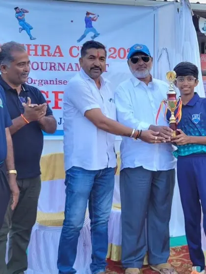 Gian KG receiving the Best Fielder award at the Dasara Cup Hubli.