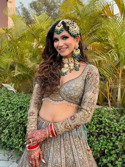 Another picture-perfect portrait. The lighting highlights her glowing skin and the intricate details of her jewelry.