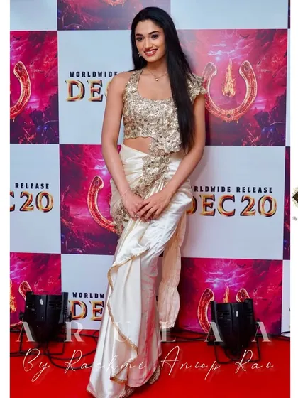 For the 'UI' movie promotions, I designed this concept saree for Reeshma Nanaiah. The highlight is the heavily embellished halter-neck blouse, paired with a pre-draped satin saree for a modern, red-carpet-ready look.