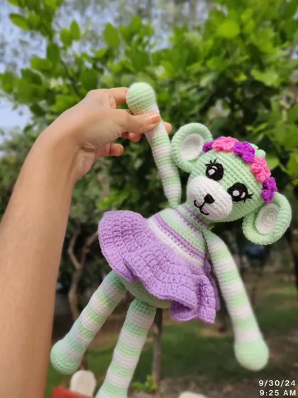 This monkey doll is ready for a dance with its fun, dangly legs.