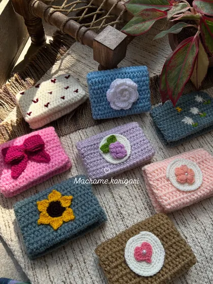 Our collection of mini crochet card wallets, each with a unique, adorable design. From sunflowers to hearts, these wallets are perfect for carrying your essential cards and a little cash.