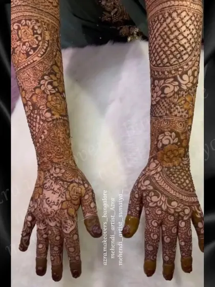 A full coverage bridal design with a focus on floral patterns and detailed filler work, ensuring a rich and complete look.