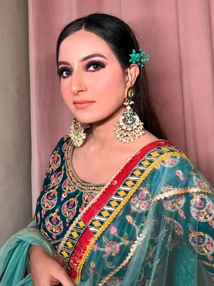 This look is all about the details. The green hair accessory picks up the colors in her beautiful outfit.