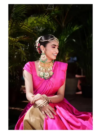 A joyful, smiling portrait from the same series, capturing the model's happiness and the beauty of her traditional attire.