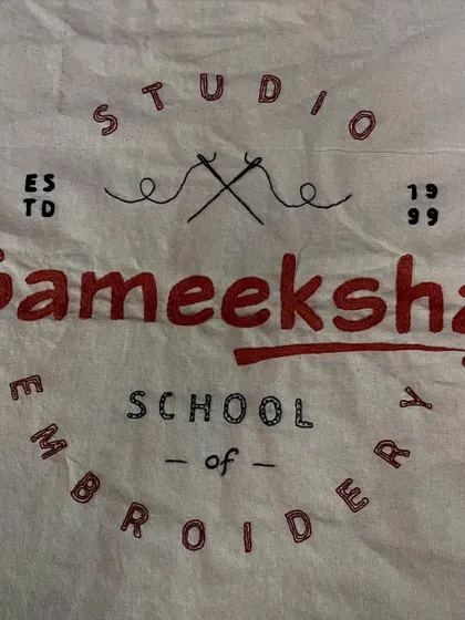 The logo for Sameeksha Studio and School of Embroidery, hand-stitched and ready to be framed. It felt right to represent my brand using the very craft I teach.