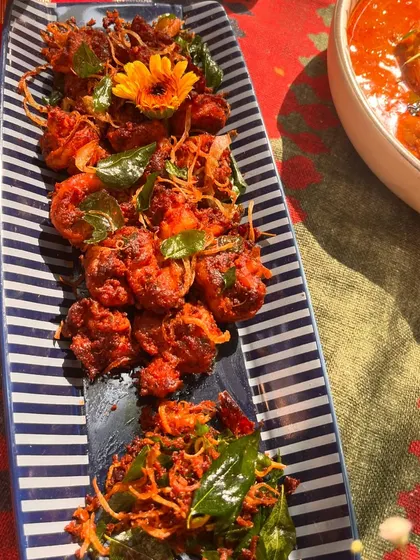 A platter of our Nasrani-style fried prawns, a popular item on our Christmas menu. Crispy, spicy, and full of flavor, they are a tribute to Kerala's coastal cuisine.