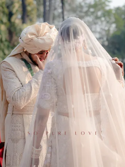"So pure love." A tender moment during the first look, as the groom gets emotional seeing his bride under her veil.