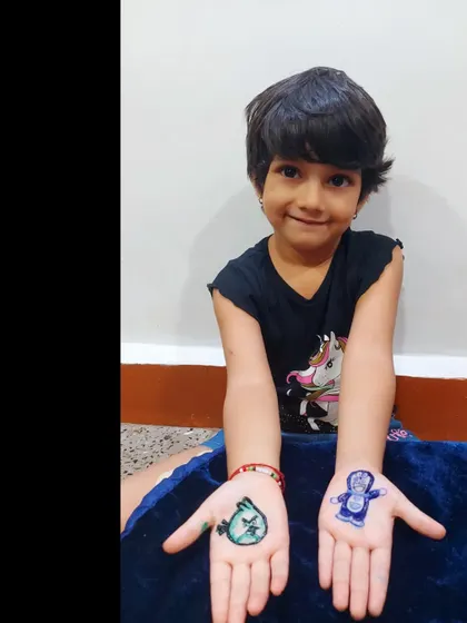 The happy client with her custom cartoon mehndi. Seeing smiles like this is the best reward.