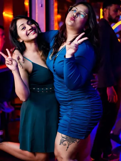 Peace signs and smiles all around. This is the kind of positive energy that makes a party at The Fixx Bar unforgettable.