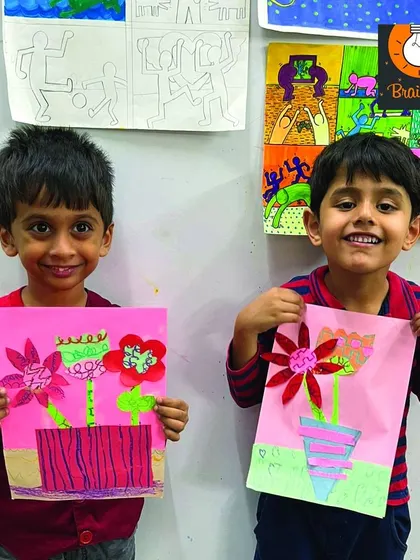 These two friends are so happy with their flower vase collages. Art class is a wonderful place to build friendships while creating together.