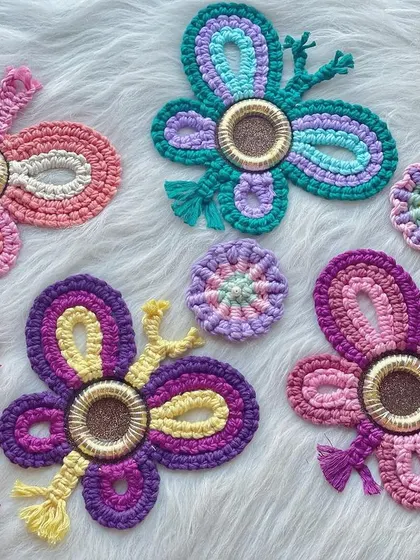 A flutter of colorful butterflies. These macrame butterflies can be hung on the wall or used as decorations for a garden party.