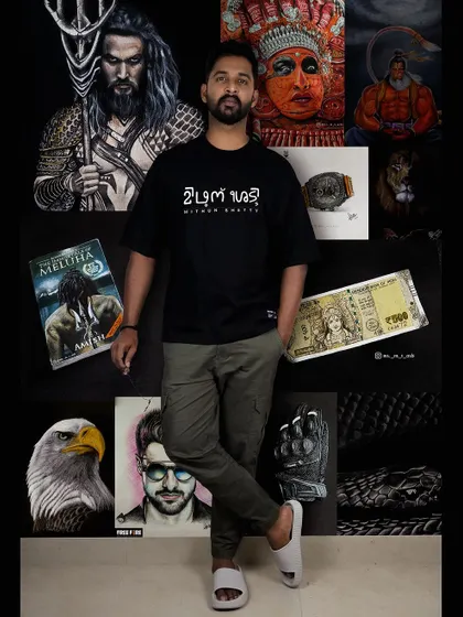 A look at me with a collection of my artworks. This photo shows the variety in my portfolio, from pop culture portraits and cultural pieces to realistic digital paintings and my own Tulu script branding.