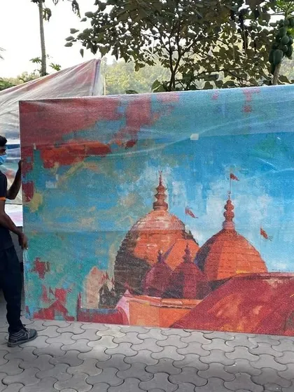 Another shot of the delivery process. It takes a team to move a canvas of this size safely.
