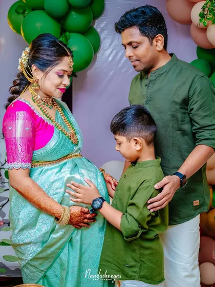 A duplicate of 154, this photo beautifully captures the complete family, united in their love and anticipation for the new baby.