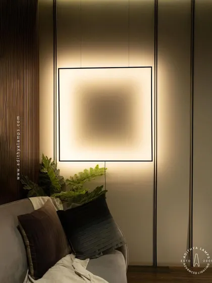 This unique floor-to-ceiling fixture features a large, suspended square frame that washes the wall with a soft, ambient light. It acts as both a light source and a bold, graphic art piece for a contemporary living room.