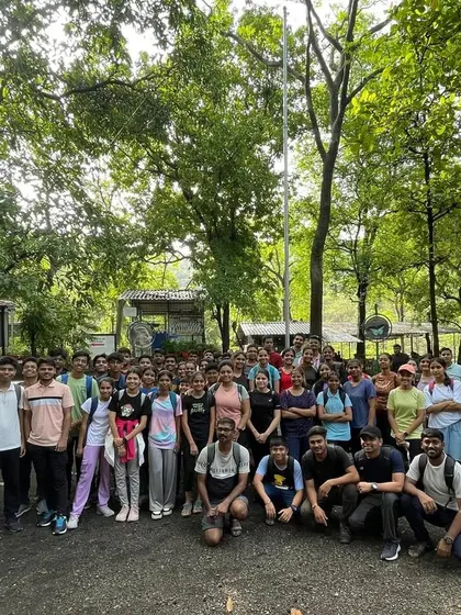 The entire team, including over 60 shooters and coaches, posing for a group photo during our traditional Karnala Fort trek. This outing is a long-standing tradition that builds team spirit outside the range.