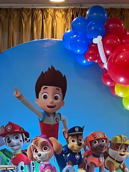 The full Paw Patrol team featured on a vibrant blue backdrop, ready for a birthday adventure.