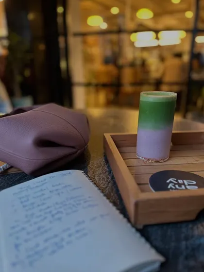 Life lately: slow days, matcha, and a whole lot of love. A flat lay of my journal and a pretty drink.