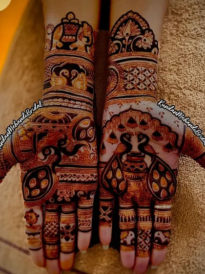 An intricate design featuring peacocks and kalash motifs, perfect for a bride who wants a very traditional and detailed look.