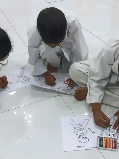 After a session of focused training, we have our joy time. Here, my karatekas are enjoying a coloring activity together. I believe in balancing discipline with fun to nurture creativity and build strong friendships within the class.